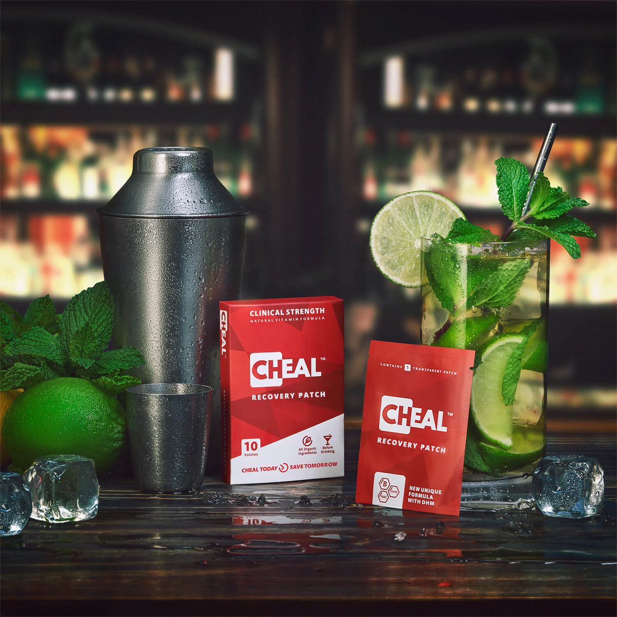 Cheal Recovery Patch boxes on a bar next to a cocktail shaker and a mojito